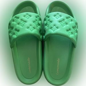 Green designer inspired pool slides